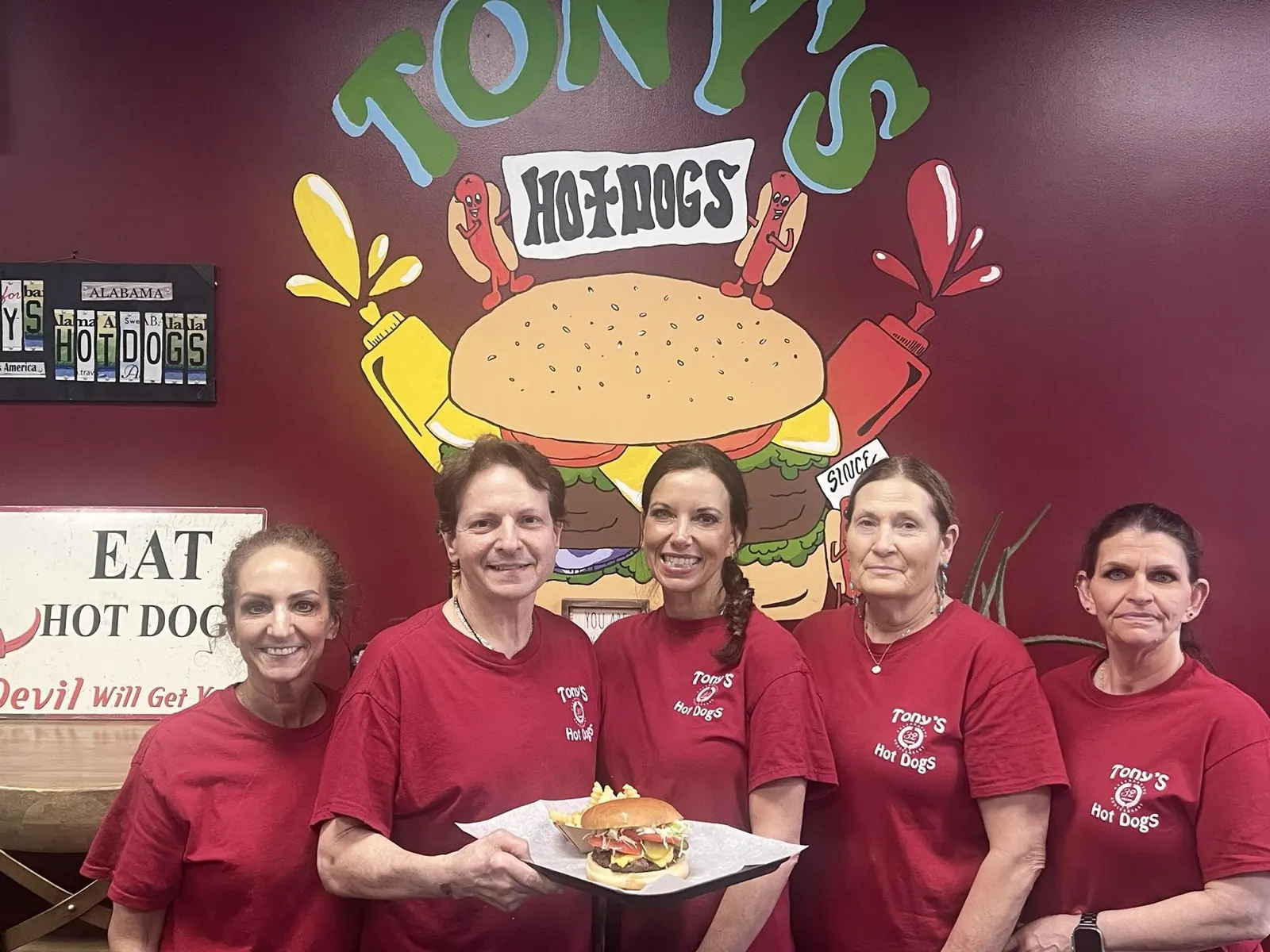 Joseph and Misty Tortomasi with the Tony's Hot Dogs team in Hoover, Alabama